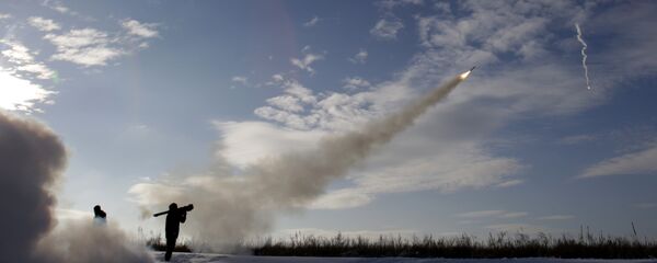 Ukrainian soldiers fire missiles with man-portable air-defense systems, file photo. - Sputnik International
