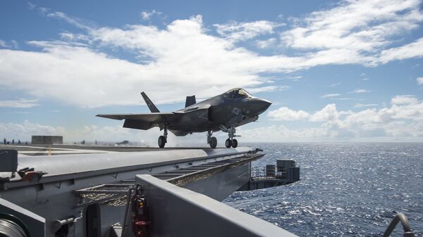 An F-35C Lightning II carrier variant joint strike fighter assigned to the Salty Dogs of Air Test and Evaluation Squadron (VX) 23 launches off the flight deck of the aircraft carrier USS Dwight D. Eisenhower (CVN 69). - Sputnik International