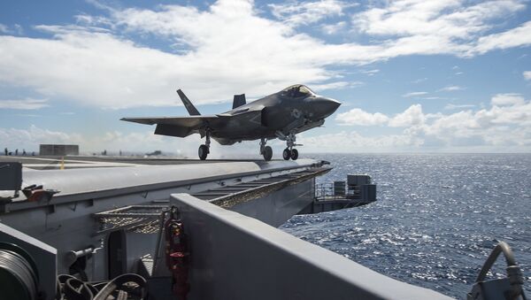An F-35C Lightning II carrier variant joint strike fighter assigned to the Salty Dogs of Air Test and Evaluation Squadron (VX) 23 launches off the flight deck of the aircraft carrier USS Dwight D. Eisenhower (CVN 69). - Sputnik International