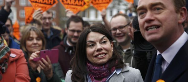 Liberal Democrats winner of the Richmond Park by-election, Sarah Olney, celebrates her victory with party leader Tim Farron on Richmond Green in London, Britain December 2, 2016. Liberal Democrats winner of the Richmond Park by-election, Sarah Olney, celebrates her victory with party leader Tim Farron on Richmond Green in London, Britain December 2, 2016. - Sputnik International