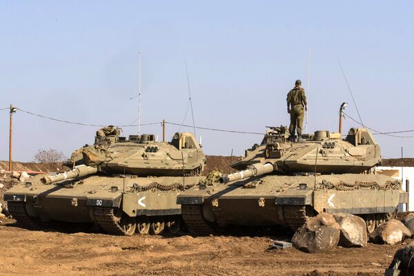 An Israeli soldier stands on top of a Merkava tank near the border with Syria in the Israeli-annexed Golan Heights, on November 28, 2016 An Israeli soldier stands on top of a Merkava tank near the border with Syria in the Israeli-annexed Golan Heights, on November 28, 2016 - Sputnik International