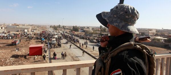 A member of Iraqi security forces stands guard during an operation against Islamic State militants in Mosul, Iraq, December 3, 2016 A member of Iraqi security forces stands guard during an operation against Islamic State militants in Mosul, Iraq, December 3, 2016 - Sputnik International