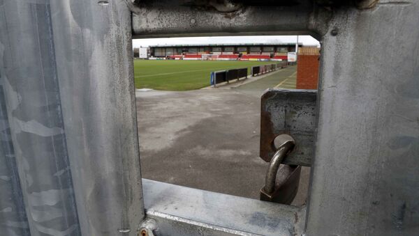 The Crewe Alexandra Football Club ground is seen through a hole in a locked gate in Crewe, Britain November 27, 2016 - Sputnik International
