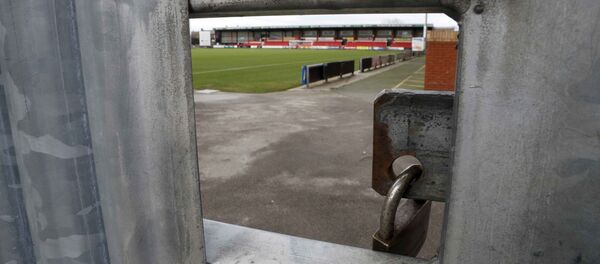 The Crewe Alexandra Football Club ground is seen through a hole in a locked gate in Crewe, Britain November 27, 2016 The Crewe Alexandra Football Club ground is seen through a hole in a locked gate in Crewe, Britain November 27, 2016 - Sputnik International