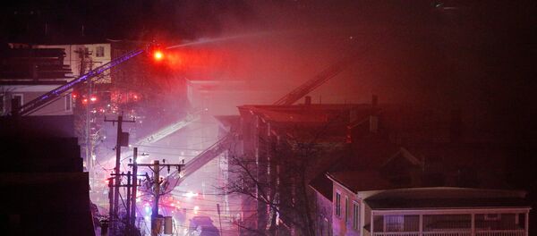 Firefighters battle a multi-alarm fire in a residential area of Cambridge, Massachusetts, U.S., December 3, 2016. Firefighters battle a multi-alarm fire in a residential area of Cambridge, Massachusetts, U.S., December 3, 2016. - Sputnik International