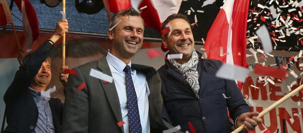 In this May 20, 2016 file photo Norbert Hofer candidate for presidential elections of Austria's Freedom Party, FPOE, and Heinz-Christian Strache, from left, head of Austria's Freedom Party, FPOE, look out at supporters during the final election campaign event in Vienna In this May 20, 2016 file photo Norbert Hofer candidate for presidential elections of Austria's Freedom Party, FPOE, and Heinz-Christian Strache, from left, head of Austria's Freedom Party, FPOE, look out at supporters during the final election campaign event in Vienna - Sputnik International