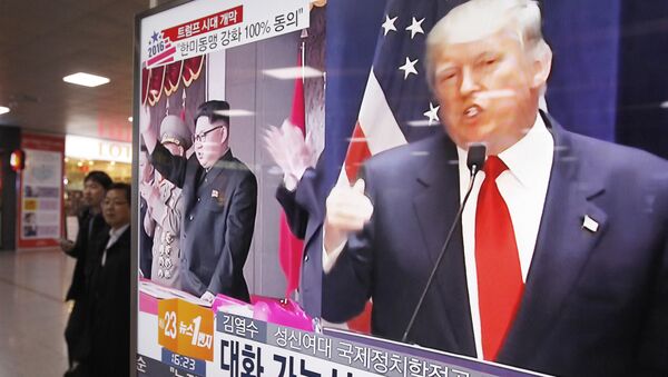 In this Nov. 10, 2016 file photo, a TV screen shows pictures of U.S. President-elect Donald Trump, right, and North Korean leader Kim Jong Un, at the Seoul Railway Station in Seoul, South Korea - Sputnik International