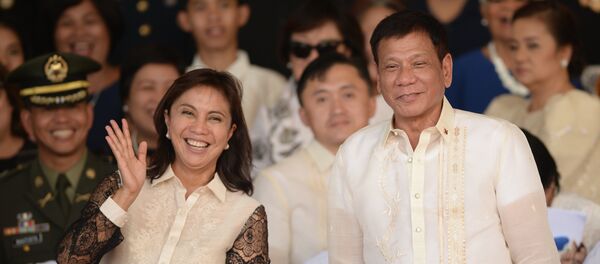 This file photo taken on July 1, 2016 shows Philippines' President Rodrigo Duterte (R) posing for photographs with Vice-President Leni Robredo after the military parade at the military headquarters in Manila This file photo taken on July 1, 2016 shows Philippines' President Rodrigo Duterte (R) posing for photographs with Vice-President Leni Robredo after the military parade at the military headquarters in Manila - Sputnik International