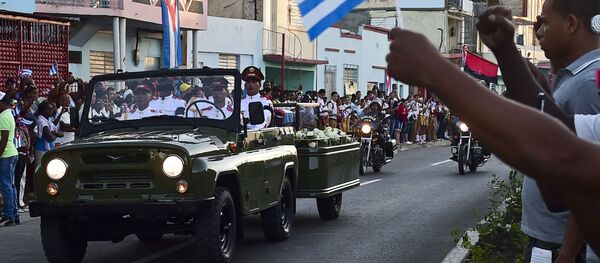 The urn with the ashes of Cuban leader Fidel Castro leaves Revolution Square in Santiago, Cuba on December 4, 2016 on its way to the cemetery - Sputnik International