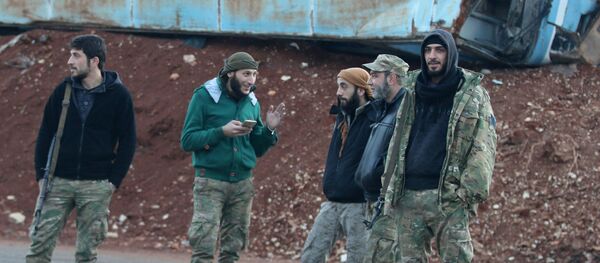 Rebel fighters stand near a damaged bus used as a barricade in the rebel-held besieged Bab al-Hadid neighbourhood of Aleppo, Syria December 2, 2016 Rebel fighters stand near a damaged bus used as a barricade in the rebel-held besieged Bab al-Hadid neighbourhood of Aleppo, Syria December 2, 2016 - Sputnik International