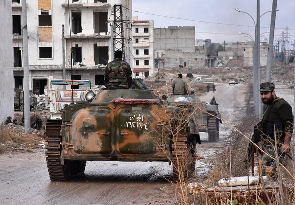 Syrian pro-government forces set up an outpost on December 2, 2016 in the Aleppo's eastern neighbourhood of Sakan al-Shababi after they retook from rebel fighters Syrian pro-government forces set up an outpost on December 2, 2016 in the Aleppo's eastern neighbourhood of Sakan al-Shababi after they retook from rebel fighters - Sputnik International