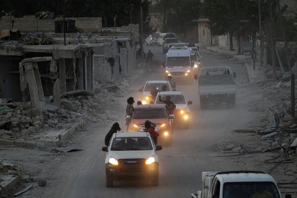 Rebel fighters drive their vehicles celebrating what they said was the taking over of Baraghedeh and Kafr-Ghan towns, in al-Rai town, northern Aleppo countryside, Syria October 10, 2016 Rebel fighters drive their vehicles celebrating what they said was the taking over of Baraghedeh and Kafr-Ghan towns, in al-Rai town, northern Aleppo countryside, Syria October 10, 2016 - Sputnik International