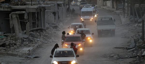 Rebel fighters drive their vehicles celebrating what they said was the taking over of Baraghedeh and Kafr-Ghan towns, in al-Rai town, northern Aleppo countryside, Syria October 10, 2016 Rebel fighters drive their vehicles celebrating what they said was the taking over of Baraghedeh and Kafr-Ghan towns, in al-Rai town, northern Aleppo countryside, Syria October 10, 2016 - Sputnik International