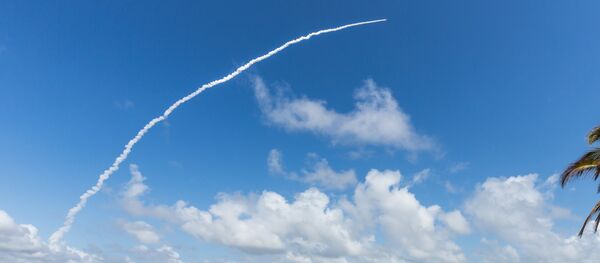 People take photos as an Ariane 5 space rocket with a payload of four Galileo satellites lifts off from ESA's European Spaceport in Kourou, French Guiana, on November 17, 2016 - Sputnik International
