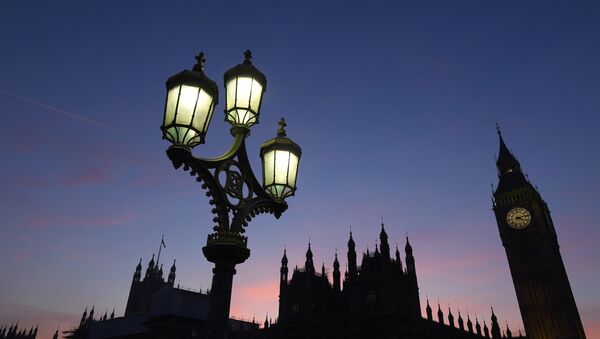 Dusk falls behind the Houses of Parliament on a clear evening in Westminster, central London, Britain December 5, 2016. - Sputnik International