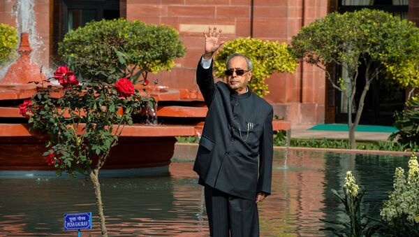 Indian President Pranab Mukherjee waves in the Mughal Gardens at the President's House in New Delhi - Sputnik International