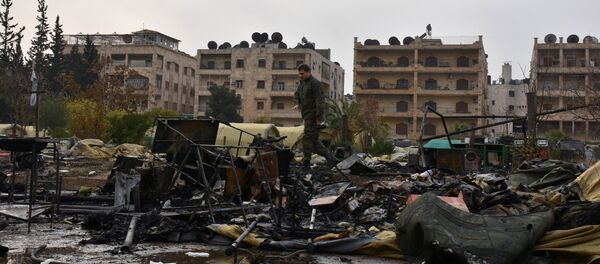 A Russian soldier inspects the damage at a Russian military field hospital after it was shelled by what the Russian Defence Ministry said were Syrian rebels in Aleppo, Syria, in this handout picture provided by SANA on December 5, 2016. A Russian soldier inspects the damage at a Russian military field hospital after it was shelled by what the Russian Defence Ministry said were Syrian rebels in Aleppo, Syria, in this handout picture provided by SANA on December 5, 2016. - Sputnik International