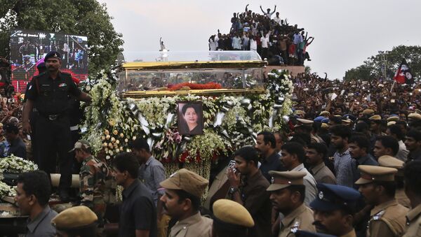 A glass casket carrying body of India's popular politician and former film actress Jayaram Jayalalithaa is taken in a funeral procession in Chennai, India, Tuesday, Dec. 6, 2016. Jayalalithaa, chief minister of Tamil Nadu state, died overnight following a heart attack a day earlier. - Sputnik International