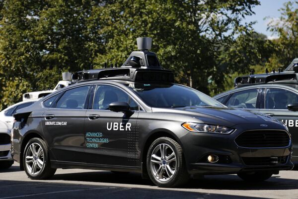 A group of self driving Uber vehicles position themselves to take journalists on rides during a media preview at Uber's Advanced Technologies Center in Pittsburgh, Monday, Sept. 12, 2016. A group of self driving Uber vehicles position themselves to take journalists on rides during a media preview at Uber's Advanced Technologies Center in Pittsburgh, Monday, Sept. 12, 2016. - Sputnik International