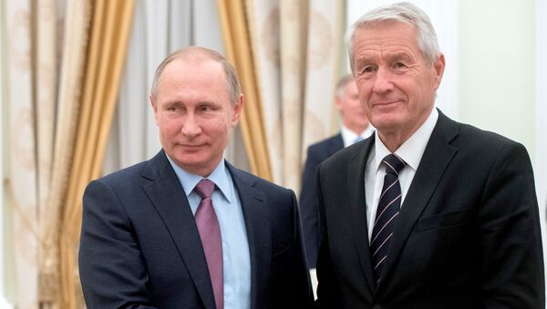 Russian President Vladimir Putin shakes hands with Council of Europe Secretary General Thorbjorn Jagland during their meeting at the Kremlin in Moscow, Russia - Sputnik International