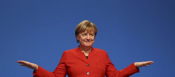 German Chancellor and leader of the conservative Christian Democratic Union party CDU Angela Merkel reacts after her speech at the CDU party convention in Essen, Germany, December 6, 2016. German Chancellor and leader of the conservative Christian Democratic Union party CDU Angela Merkel reacts after her speech at the CDU party convention in Essen, Germany, December 6, 2016. - Sputnik International