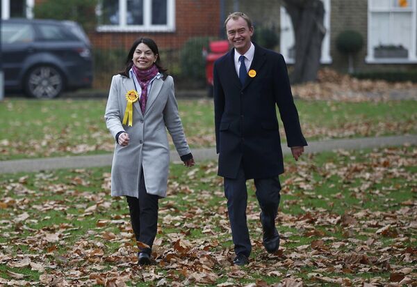 Liberal Democrats winner of the Richmond Park by-election, Sarah Olney, arrives to celebrate her victory with party leader Tim Farron (R) on Richmond Green in London, Britain December 2, 2016. Liberal Democrats winner of the Richmond Park by-election, Sarah Olney, arrives to celebrate her victory with party leader Tim Farron (R) on Richmond Green in London, Britain December 2, 2016. - Sputnik International