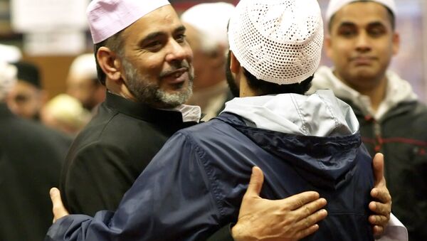 Muslims celebrate at the end of prayers 11 January 2005 during celebrations of the the Eid al-Adha festival, commemorating the prophet Abraham's willingness to sacrifice his son Ismail on God's orders, in Luton's Central Mosque. - Sputnik International