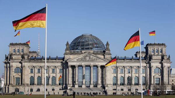 German flags wave in front of the Reichstag building, host of the German Federal Parliament Bundestag, in Berlin, Germany. (File) - Sputnik International