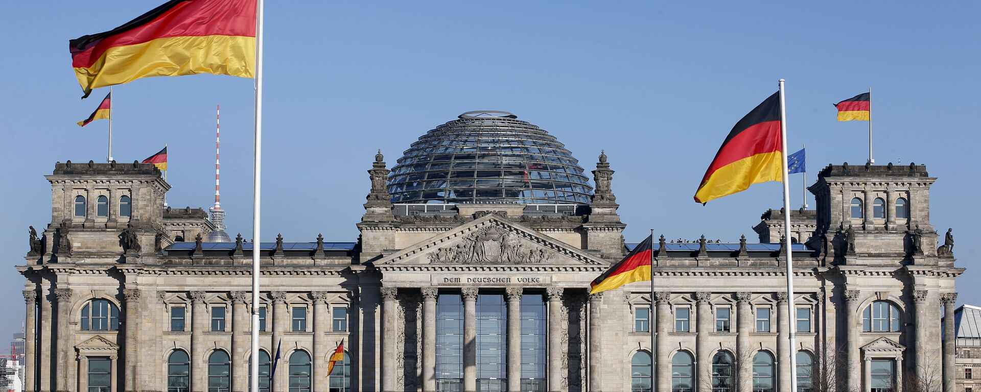 German flags wave in front of the Reichstag building, host of the German Federal Parliament Bundestag, in Berlin, Germany. (File) - Sputnik International, 1920, 23.11.2023