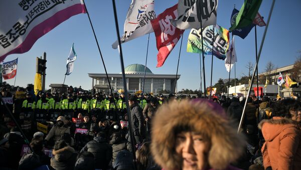 Protesters gather outside the National Assembly to demand the impeachment of South Korean President Park Geun-Hye, in Seoul on December 9, 2016 - Sputnik International