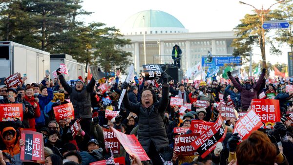 People react after impeachment vote on South Korean President Park Geun-hye was passed, in front of the National Assembly in Seoul, South Korea, December 9, 2016. The sign reads Impeach Park Geun-hye. - Sputnik International