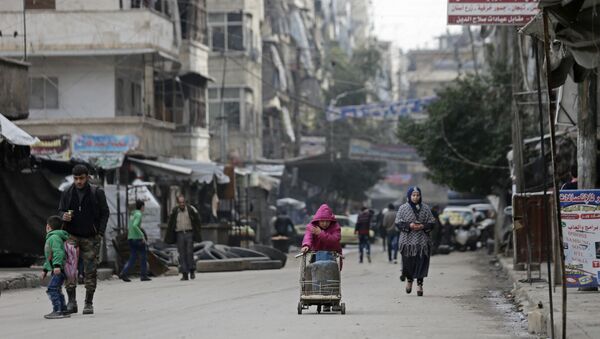 Syrian girl pushes a cart loaded with cooking gas canisters, in Aleppo, Syria. - Sputnik International