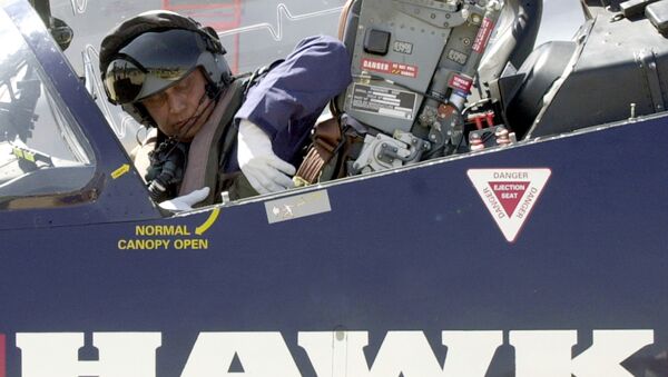 Chief of Indian Air Force Air Chief marshal SP Tyagi unfastens his seatbelt as he gets out of a BAE systems HAWK advanced jet trainer after flying it over the Yehlanka Air force Station on the outskirts of Bangalore on the eve of the Aero India 2005 aerospace show. (File) - Sputnik International