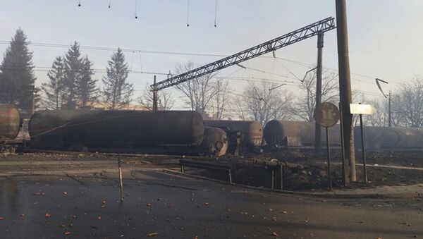 In this photo released by Bulgarian Interior Ministry, burned containers are seen derailed after an explosion upon derailment in the village of Hitrino in Bulgaria Saturday, Dec 10, 2016 - Sputnik International
