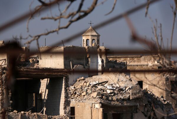 A part of a church is seen amid the damage in the government-controlled area of the Old City of Aleppo, Syria December 10, 2016 - Sputnik International