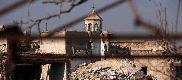 A part of a church is seen amid the damage in the government-controlled area of the Old City of Aleppo, Syria December 10, 2016 - Sputnik International