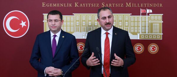 General Secretary of Turkish Justice and Development Party (AKP) Abdulhamit Gul (R) and Turkish Nationalist Movement Party's (MHP) deputy of Afyonkarahisar Mehmet Parsak (L) address a press conference at the Grand National Assembly of Turkey (TBMM) in Ankara on December 10, 2016, after a constitutional amendment bill was submitted to Turkish parliament - Sputnik International