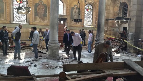 Egyptian security forces examine the scene inside St. Mark Cathedral in central Cairo, following a bombing, Sunday, Dec. 11, 2016 - Sputnik International