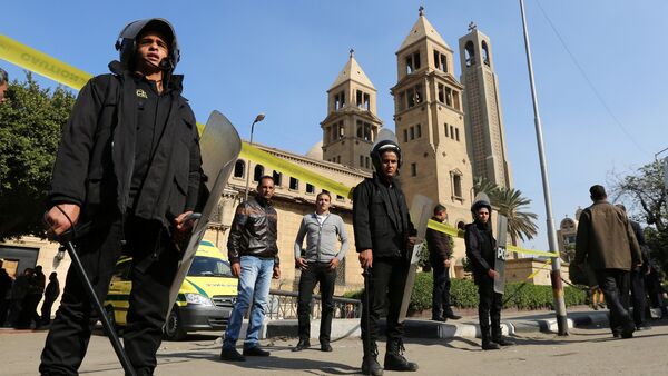 Members of the special police forces stand guard to secure the area around St. Mark's Coptic Orthodox Cathedral after an explosion inside the cathedral in Cairo, Egypt December 11, 2016 - Sputnik International
