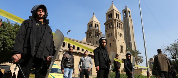 Members of the special police forces stand guard to secure the area around St. Mark's Coptic Orthodox Cathedral after an explosion inside the cathedral in Cairo, Egypt December 11, 2016 Members of the special police forces stand guard to secure the area around St. Mark's Coptic Orthodox Cathedral after an explosion inside the cathedral in Cairo, Egypt December 11, 2016 - Sputnik International