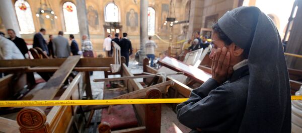 A nun cries as she stands at the scene inside Cairo's Coptic cathedral, following a bombing, in Egypt December 11, 2016 A nun cries as she stands at the scene inside Cairo's Coptic cathedral, following a bombing, in Egypt December 11, 2016 - Sputnik International