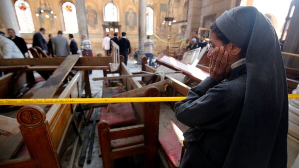 A nun cries as she stands at the scene inside Cairo's Coptic cathedral, following a bombing, in Egypt December 11, 2016 - Sputnik International