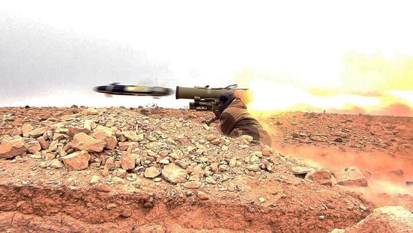 This image posted online on Saturday, Dec. 10, 2016, by supporters of the Islamic State militant group on an anonymous photo sharing website, purports to show a gunman firing an anti-tank missile at Syrian troops north of Palmyra city, in Homs Provence, Syria - Sputnik International