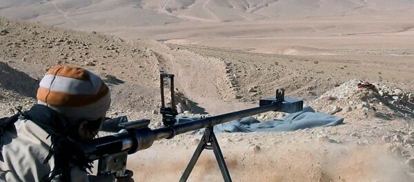 This image posted online on Saturday, Dec. 10, 2016, by Daesh supporters on an anonymous photo sharing website, purports to show a gunman firing at an unseen target, north of Palmyra in Homs Provence, Syria This image posted online on Saturday, Dec. 10, 2016, by Daesh supporters on an anonymous photo sharing website, purports to show a gunman firing at an unseen target, north of Palmyra in Homs Provence, Syria - Sputnik International