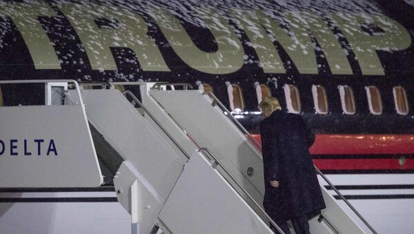 President-elect Donald Trump boards his plane at Gerald R. Ford International Airport, Friday, Dec. 9, 2016, in Grand Rapids, Mich, after attending a rally - Sputnik International
