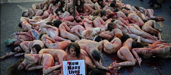 Animal rights activists Anima Naturalis stage a naked protest against the use of leather and fur in the textile industry in Barcelona, Spain, Sunday, Dec. 1, 2013. Animal rights activists Anima Naturalis stage a naked protest against the use of leather and fur in the textile industry in Barcelona, Spain, Sunday, Dec. 1, 2013. - Sputnik International