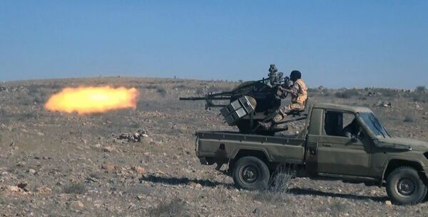 This image posted online on Dec. 10, 2016, by Daesh supporters on an anonymous photo sharing website, purports to show a gun-mounted vehicle operated by Daesh firing at Syrian troops, north of Palmyra This image posted online on Dec. 10, 2016, by Daesh supporters on an anonymous photo sharing website, purports to show a gun-mounted vehicle operated by Daesh firing at Syrian troops, north of Palmyra - Sputnik International