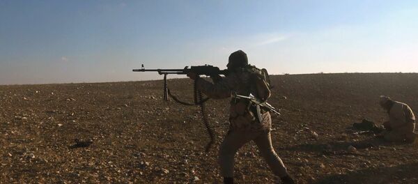 This image posted online on Saturday, Dec. 10, 2016, by supporters of the Islamic State militant group on an anonymous photo sharing website, purports to show a gunman firing at an unseen target, east of of Palmyra, east of Palmyra city, in Homs provence, Syria - Sputnik International