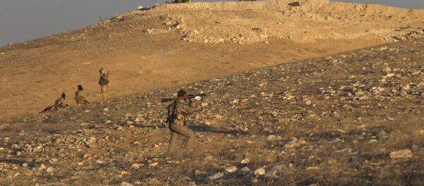 This image posted online on Saturday, Dec. 10, 2016, by supporters of the Islamic State militant group on an anonymous photo sharing website, shows gunmen with a shoulder-propelled weapon east of Palmyra city, in Homs Provence, Syria This image posted online on Saturday, Dec. 10, 2016, by supporters of the Islamic State militant group on an anonymous photo sharing website, shows gunmen with a shoulder-propelled weapon east of Palmyra city, in Homs Provence, Syria - Sputnik International