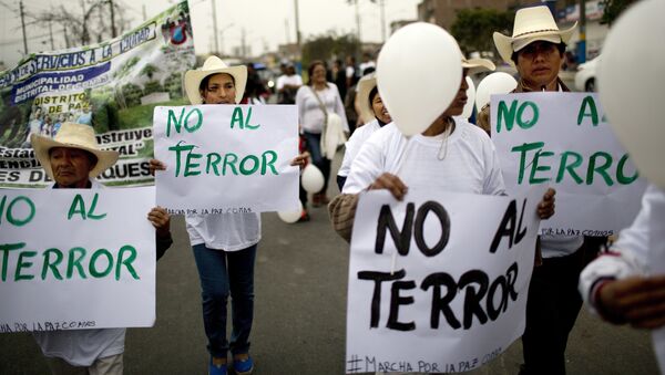 Women hold posters that read in Spanish No to terror during a march for peace and against terrorism in Comas district, Lima, Peru, on Thursday, Sept. 29, 2016 - Sputnik International